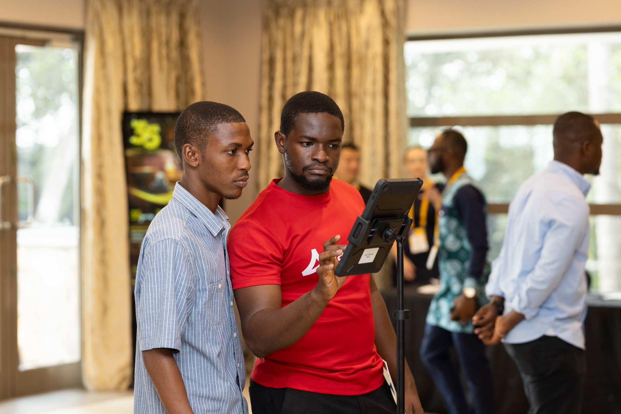 Ayalogbook agent checking a guest in on a tablet